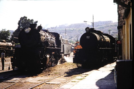 Hedjaz Jordan Railway 2-8-2 steam locomotives no. 51 and no. 82 stand side by side in Amman, Jordan, on July 17, 1991. Photograph by Fred M. Springer, © 2014, Center for Railroad Photography and Art. Springer-Hedjaz-ZimZam(1)-05-26
