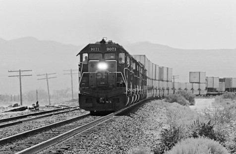 Westbound Southern Pacific Railroad stack train passes Sybil siding, west of Benson, Arizona, in August 1990. Photograph by J. Parker Lamb, © 2017, Center for Railroad Photography and Art. Lamb-02-124-12