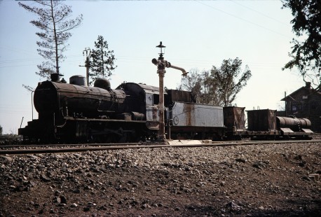 Syrian Railways steam locomotive no. 162 waits at a water column in Daraa, Daraa, Syria on July 19, 1991. Photograph by Fred M. Springer, © 2014, Center for Railroad Photography and Art. Springer-Hedjaz-ZimZam(1)-08-10