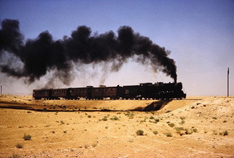 Hedjaz Jordan Railway and Syrian Railways 2-8-2 steam locomotive no. 51 in Petra, Ma'an, Jordan, on July 18, 1991. Photograph by Fred M. Springer, © 2014, Center for Railroad Photography and Art. Springer-Hedjaz-ZimZam(1)-06-40