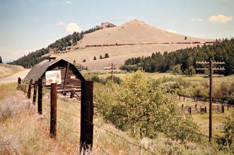 Eastbound Milwaukee Road freight train at Vendome, Montana, on July 9, 1973. Photograph by John F. Bjorklund, © 2016, Center for Railroad Photography and Art. Bjorklund-63-20-19