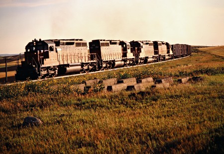 Eastbound Milwaukee Road freight train in Ives, North Dakota, on July 18, 1980. Photograph by John F. Bjorklund, © 2016, Center for Railroad Photography and Art. Bjorklund-64-30-03
