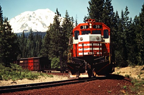 Eastbound McCloud River Railroad freight train with Mt. Shasta in background near McCloud, California, on June 22, 1984. Photograph by John F. Bjorklund, © 2016, Center for Railroad Photography and Art. Bjorklund-93-14-07