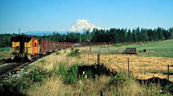 Southbound Milwaukee Road freight train in Thrift, Washington, with Mt. Rainier in the background on August 7, 1978. Photograph by John F. Bjorklund, © 2016, Center for Railroad Photography and Art. Bjorklund-64-30-15