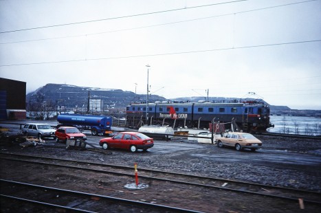 Swedish State Railways electric locomotive and surrounding cars in Kiruna, Norrbotten, Sweden, on a journey to Narvik, on June 1, 1996. Photograph by Fred M. Springer, © 2014, Center for Railroad Photography and Art. Springer-So.Africa-NOR-SWE-16-20