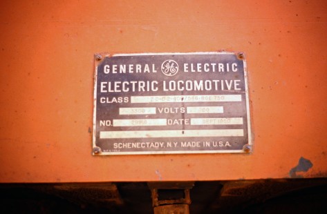 Milwaukee Road "Little Joe" electric locomotive builder's plate at Avery, Idaho, on July 11, 1973. Photograph by John F. Bjorklund, © 2016, Center for Railroad Photography and Art. Bjorklund-63-26-19
