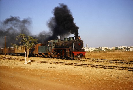 Syrian Railways 2-8-2 steam locomotive no. 263 in Daraa, Daraa, Syria on July 21, 1991. Photograph by Fred M. Springer, © 2014, Center for Railroad Photography and Art. Springer-Hedjaz-ZimZam(1)-11-04