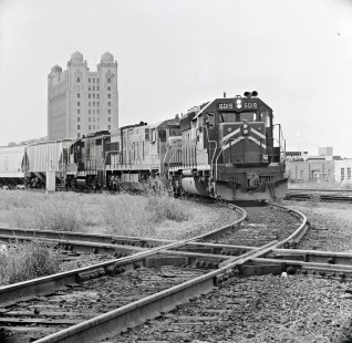 Southbound Union Pacific Railroad freight train passes former Texas and Pacific Railway headquarters in downtown Fort Worth, Texas, in July 1995. Train has come eastward from UP's Davidson Yard before turning southward at downtown interlocker. Photograph by J. Parker Lamb, © 2017, Center for Railroad Photography and Art. Lamb-02-122-06