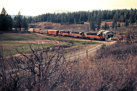 Eastbound Milwaukee Road freight train in Plummer, Idaho, on April 29, 1975. Photograph by John F. Bjorklund, © 2016, Center for Railroad Photography and Art. Bjorklund-64-21-06