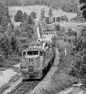 Illinois Central Gulf Railroad local twists around S-curve on ex-Gulf, Mobile and Ohio Railroad line north of Meridian, Mississippi, in August 1975. Photograph by J. Parker Lamb, © 2017, Center for Railroad Photography and Art. Lamb-02-119-12