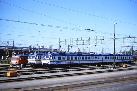 An array of Swedish State Railways and "Sturven" Gl Taget electric multiple units (EMUs) in Gothenburg, Västra Götaland, Norway, on June 11, 1989. Photograph by Fred M. Springer, © 2014, Center for Railroad Photography and Art. Springer-Scan-Swiss-York-10-07