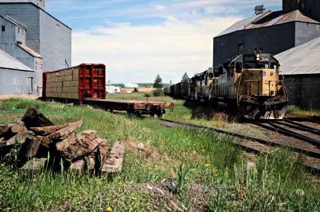 Westbound Camas Prairie Railroad freight train, owned and operated by Burlington Northern Railroad and Union Pacific Railroad, at Craigmont, Idaho, on July 1, 1988. Photograph by John F. Bjorklund, © 2016, Center for Railroad Photography and Art. Bjorklund-93-20-14