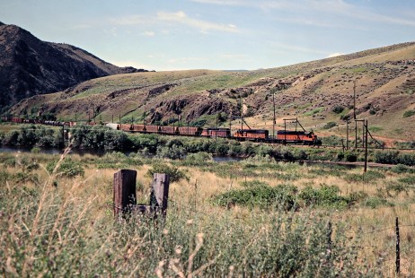 Westbound Milwaukee Road freight train in Jefferson Canyon near Jefferson Island, Montana, on July 8, 1979. Photograph by John F. Bjorklund, © 2016, Center for Railroad Photography and Art. Bjorklund-67-23-16