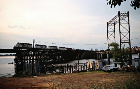 Southbound Kansas City Southern Railway freight train crossing Cado Lake at Mooringsport, Louisiana, on July 22, 1977. Photograph by John F. Bjorklund, © 2016, Center for Railroad Photography and Art. Bjorklund-61-24-03