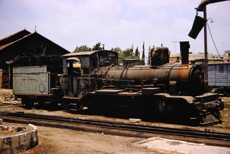 Syrian Railways steam locomotive in Daraa, Daraa, Syria on July 19, 1991. Photograph by Fred M. Springer, © 2014, Center for Railroad Photography and Art. Springer-Hedjaz-ZimZam(1)-07-08