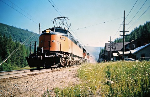 Westbound Milwaukee Road freight train led by "Little Joe" electric locomotive no. E70 at East Portal, Montana, on July 12, 1973. Photograph by John F. Bjorklund, © 2016, Center for Railroad Photography and Art. Bjorklund-63-22-06