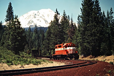 Eastbound McCloud River Railroad freight train with Mt. Shasta in background near McCloud, California, on June 22, 1984. Photograph by John F. Bjorklund, © 2016, Center for Railroad Photography and Art. Bjorklund-93-14-09