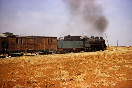 Syrian Railways 2-8-2 steam locomotive no. 263 stopped in Bosra, Daraa, Syria on July 21, 1991. Photograph by Fred M. Springer, © 2014, Center for Railroad Photography and Art. Springer-Hedjaz-ZimZam(1)-12-05