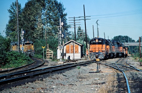 Northbound Milwaukee Road freight train and northbound Union Pacific Railroad train meet at Tacoma Junction, Washington, on August 7, 1978. Photograph by John F. Bjorklund, © 2016, Center for Railroad Photography and Art. Bjorklund-67-01-08
