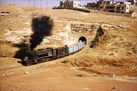 Hedjaz Jordan Railway 2-8-2 steam locomotive no. 71 as it exits from a hill tunnel in Amman, Jordan, on July 15, 1991. Photograph by Fred M. Springer, © 2014, Center for Railroad Photography and Art. Springer-Hedjaz-ZimZam(1)-03-23