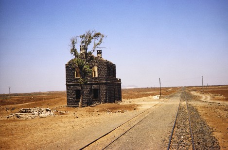 Syrian Railways tracks and crumbling station in Daraa, Daraa, Syria on July 21, 1991. Photograph by Fred M. Springer, © 2014, Center for Railroad Photography and Art. Springer-Hedjaz-ZimZam(1)-11-28