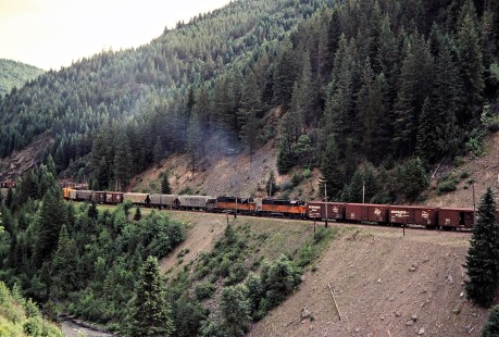 Eastbound Milwaukee Road freight train with mid-train helper locomotives in Avery, Idaho, on July 11, 1979. Photograph by John F. Bjorklund, © 2016, Center for Railroad Photography and Art. Bjorklund-68-02-15