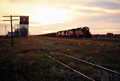 Eastbound Milwaukee Road coal train at Griffin, North Dakota, on July 18, 1980. Photograph by John F. Bjorklund, © 2016, Center for Railroad Photography and Art. Bjorklund-68-26-03