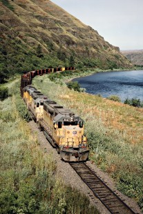 Eastbound Camas Prairie Railroad freight train, owned and operated by Burlington Northern Railroad and Union Pacific Railroad, along Clearwater River near Spalding, Idaho, on July 1, 1988. Photograph by John F. Bjorklund, © 2016, Center for Railroad Photography and Art. Bjorklund-93-17-10