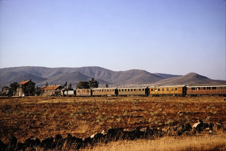 Syrian Railways steam locomotive no. 162 pulling 5 passenger cars in Daraa, Daraa, Syria on July 19, 1991. Photograph by Fred M. Springer, © 2014, Center for Railroad Photography and Art. Springer-Hedjaz-ZimZam(1)-08-04