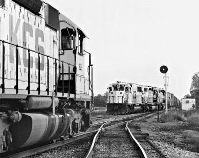 Southward Kansas City Southern Railway manifest train (no. 709) passes counterpart (no. 625) at yard in Ashdown, Arkansas, at sundown during November 1984. Photograph by J. Parker Lamb, © 2016, Center for Railroad Photography and Art. Lamb-02-073-03