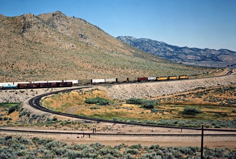 Eastbound Union Pacific freight train on the Western Pacific Railroad at Reno Junction, California, on July 22, 1982. Photograph by John F. Bjorklund, © 2016, Center for Railroad Photography and Art. Bjorklund-93-09-16