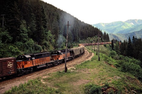 Eastbound Milwaukee Road freight train with mid-train helper locomotives in Roland, Idaho, on July 11, 1979. Photograph by John F. Bjorklund, © 2016, Center for Railroad Photography and Art. Bjorklund-68-03-15