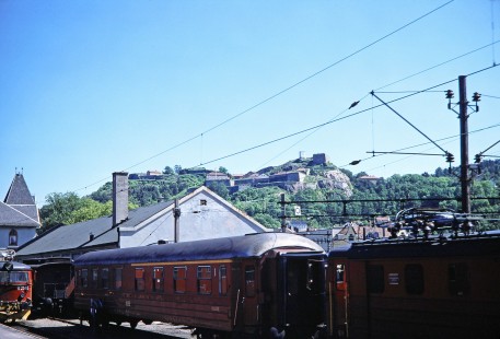 Norwegian State Railways locomotives and cars wait by the station in Halden, Ostlandet, Norway, on June 11, 1989. Photograph by Fred M. Springer, © 2014, Center for Railroad Photography and Art. Springer-Scan-Swiss-York-10-12
