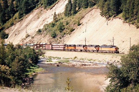 Westbound Milwaukee Road freight train in Drexel, Montana, on July 11, 1973. Photograph by John F. Bjorklund, © 2016, Center for Railroad Photography and Art. Bjorklund-63-23-01