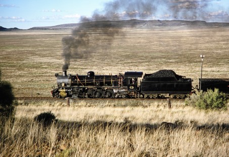 South African Railway 4-8-2 steam locomotive no. 2649 or "Anna" traveling on a hill in Springfontein, Free State, South Africa, on March 30, 1995. Photograph by Fred M. Springer, © 2014, Center for Railroad Photography and Art. Springer-So.Africa-NOR-SWE-01-06