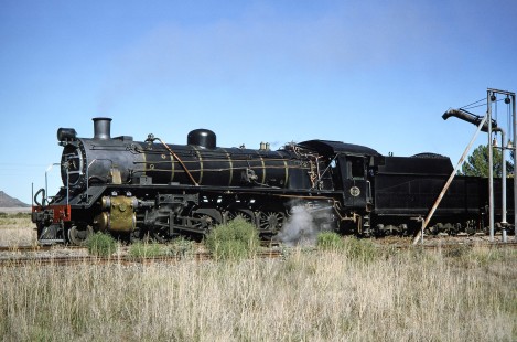 South African Railway 4-8-2 steam locomotive no. 2649 or "Anna" stopping for water in Philippolis, Free State, South Africa, on March 31, 1995. Photograph by Fred M. Springer, © 2014, Center for Railroad Photography and Art. Springer-So.Africa-NOR-SWE-02-07