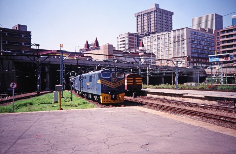 A Blue Train Railway electric locomotive arrives towards the city platform in Johannesburg, Gauteng, South Africa, on March 17, 1995. Photograph by Fred M. Springer, © 2014, Center for Railroad Photography and Art. Springer-So.Africa(1)-07-26
