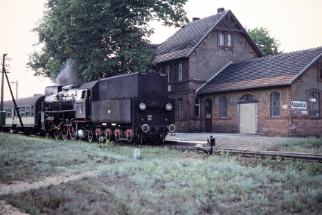Polskie Koleje Państwowe (Polish State Railways) steam locomotive no. 0l49-105 with a passenger train pulls into Kopanica station in Kopanica, Greater Poland, Poland, on May 21, 1993. Photograph by Fred M. Springer, © 2014, Center for Railroad Photography and Art. Springer-Europe-04-35