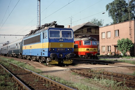 Československé Státní Dráhy (Czech Railways) electric locomotives nos. 363-128-0 (blue) and S499-0249 (red/yellow) in Veseli, Czech Republic, on May 30, 1993. Photograph by Fred M. Springer, © 2014, Center for Railroad Photography and Art. Springer-Europe-14-09