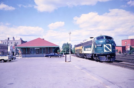 Ontario Northland Railway diesel locomotives nos. 1502 and 1504 wait beside Timmins station in Timmins, Ontario, Canada, on July 8, 1966. Photograph by Fred M. Springer, © 2014, Center for Railroad Photography and Art. Springer-East2-23-24
