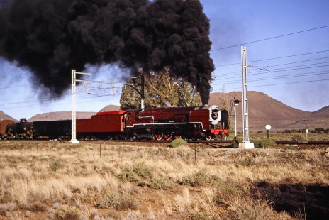 South African Railway 4-8-4 steam locomotive no. 3417 travels amongst the hilly landscape of Three Sisters, Western Cape, South Africa, on April 1, 1995. Photograph by Fred M. Springer, © 2014, Center for Railroad Photography and Art. Springer-So.Africa-NOR-SWE-05-16