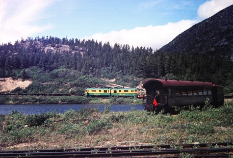 A White Pass and Yukon Route train wraps around a bend of track by the lake in Bennett, British Columbia, Canada, on June 13, 1998. Photograph by Fred M. Springer, © 2014, Center for Railroad Photography and Art. Springer-Alaska-NZ-11-26