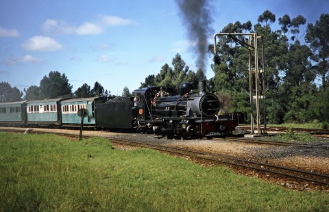 Avontuur Railway steam locomotive no. 145 pulls up to a water column in Van Stadens, Eastern Cape, South Africa, on March 25, 1995. Photograph by Fred M. Springer, © 2014, Center for Railroad Photography and Art. Springer-So.Africa(1)-19-29