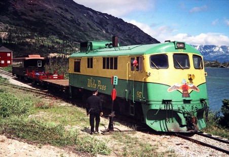 The engineer of White Pass and Yukon Route diesel locomotive no. 97 converses with the train's conductor at Fraser station in Fraser, British Columbia, Canada, on June 12, 1998. Photograph by Fred M. Springer, © 2014, Center for Railroad Photography and Art. Springer-Alaska-NZ-09-20