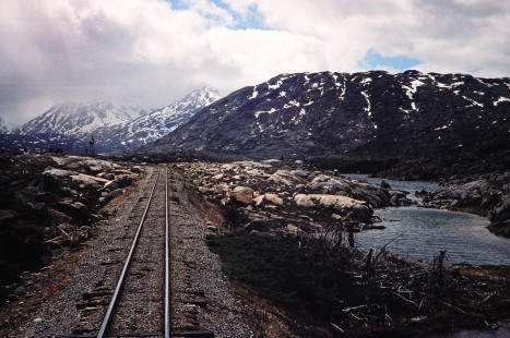 The rocky terrain and mountainous landscape along the White Pass & Yukon Railroad near Fraser, British Columbia, Canada, on June 11, 1998. Photograph by Fred M. Springer, © 2014, Center for Railroad Photography and Art. Springer-Alaska-NZ-06-13