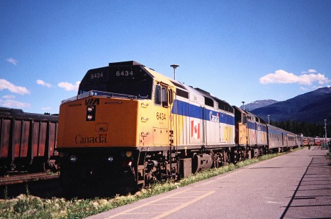 VIA Rail diesel locomotive no. 6434 with passenger train in Jasper, Alberta, Canada, on July 17, 2003. Photograph by Fred M. Springer, © 2014, Center for Railroad Photography and Art. Springer-Canada-NZ(1)-14-05