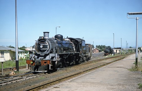 South African Railway steam locomotive moves down the George Station platform along the track in George, Western Cape, South Africa, on March 22, 1995. Photograph by Fred M. Springer, © 2014, Center for Railroad Photography and Art. Springer-So.Africa(1)-15-38