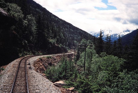 The photographer views the path of the White Pass & Yukon Railroad on the route to reach Fraser, British Columbia, Canada, on June 11, 1998. Photograph by Fred M. Springer, © 2014, Center for Railroad Photography and Art. Springer-Alaska-NZ-05-02