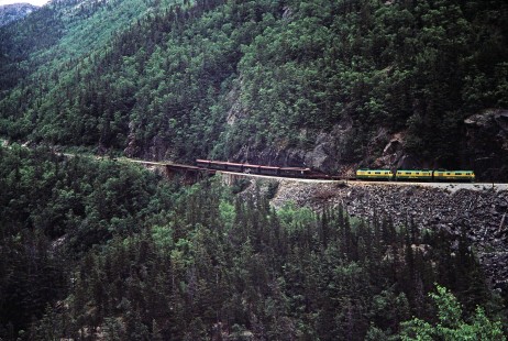 A White Pass and Yukon Route train with three diesel locomotives and eight cars rounds a curve near Skagway, Alaska, United States, on June 12, 1998. Photograph by Fred M. Springer, © 2014, Center for Railroad Photography and Art. Springer-Alaska-NZ-09-07