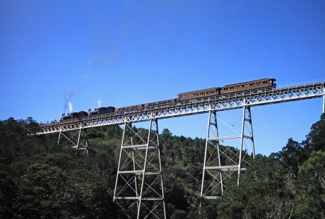 South African Railway steam locomotives no. 1007 and no. 1056 move across the Malgaaten Bridge in Western Cape, South Africa, Malgaaten Bridge, on March 21, 1995. Photograph by Fred M. Springer, © 2014, Center for Railroad Photography and Art. Springer-So.Africa(1)-13-20